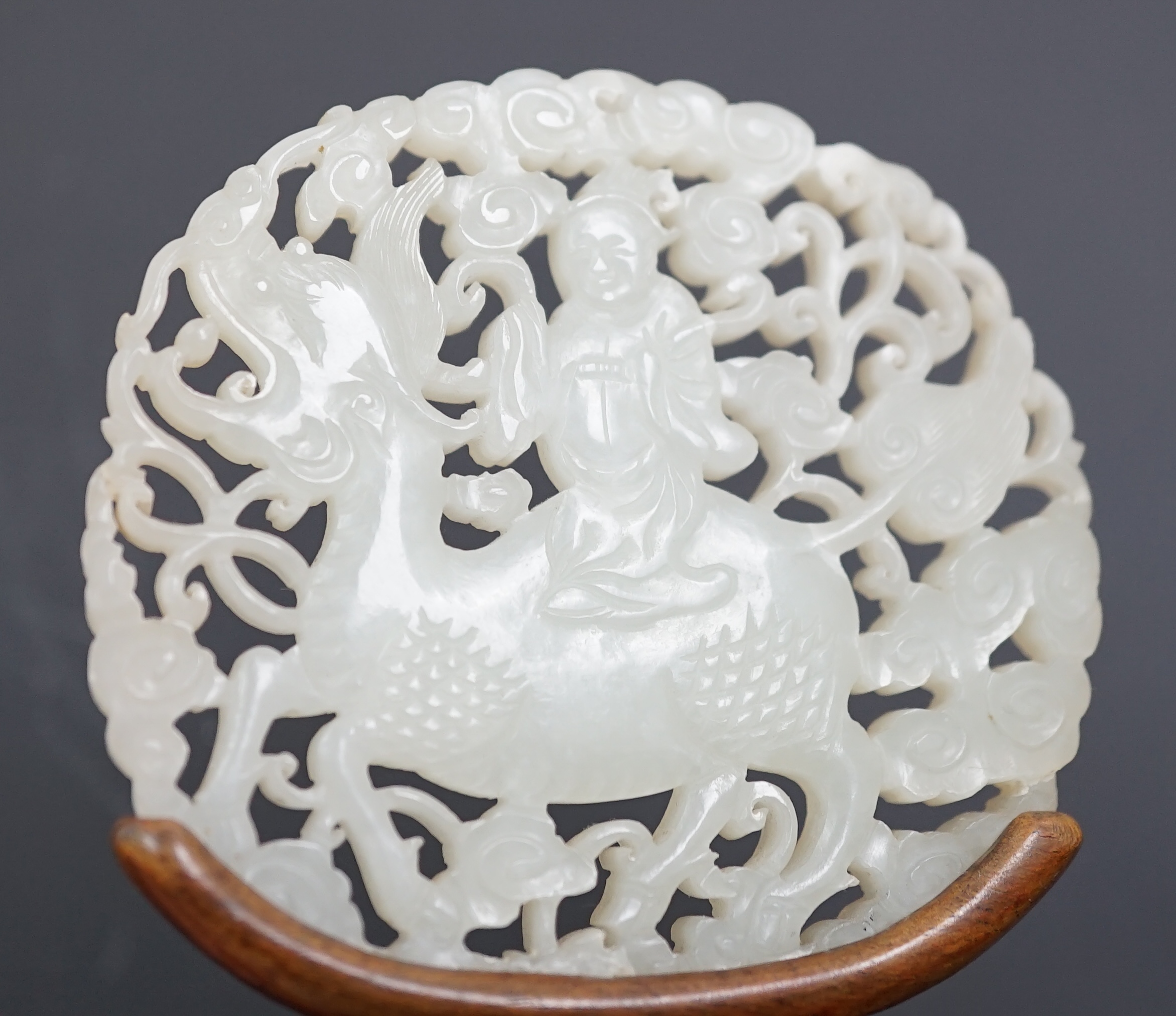 A Chinese white jade ‘qilin and rider’ plaque, 18th/19th century